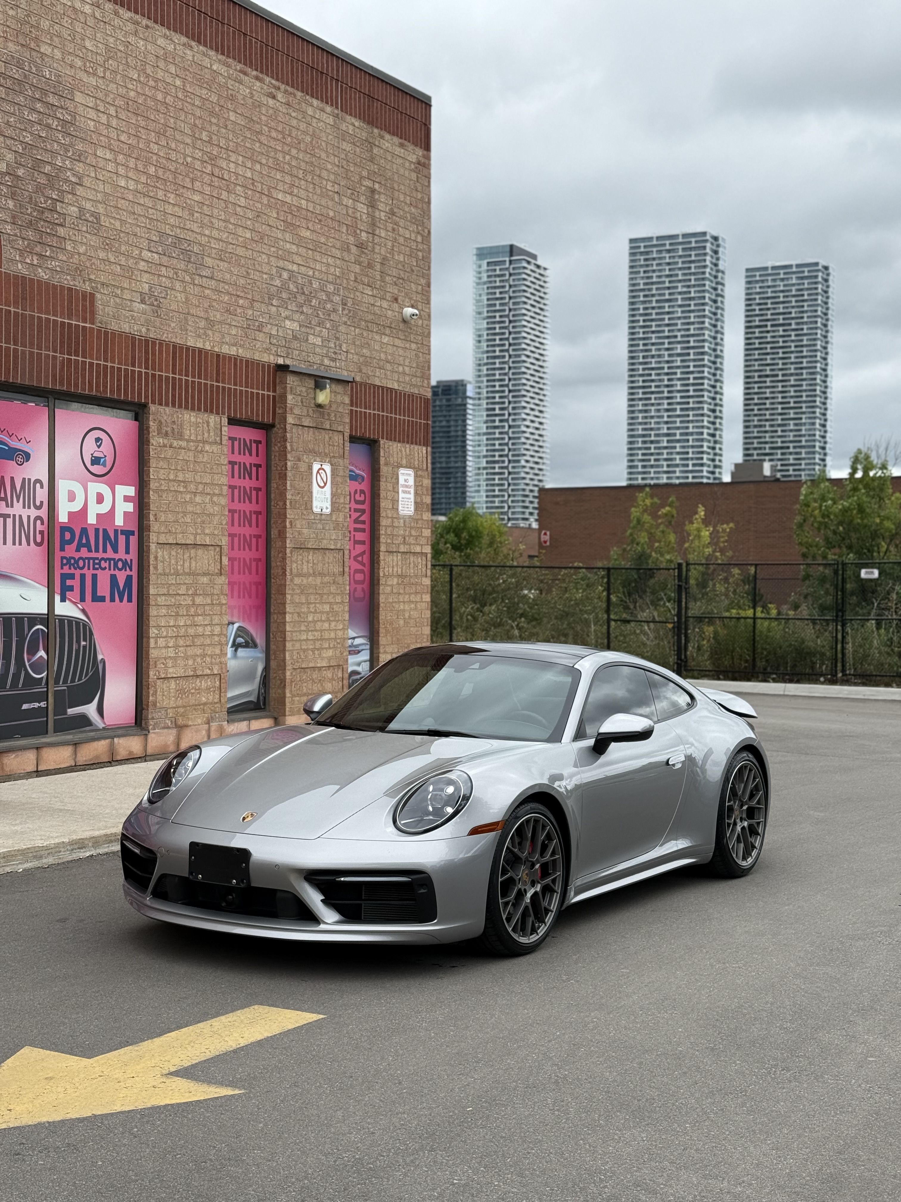 Professional paint protection film installation on luxury vehicle